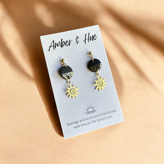 Sun Charm Black and Gold Dangle Earrings