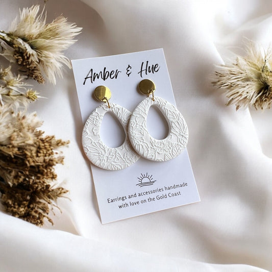 Flower Imprint White Rounded Teardrop Dangle Earrings