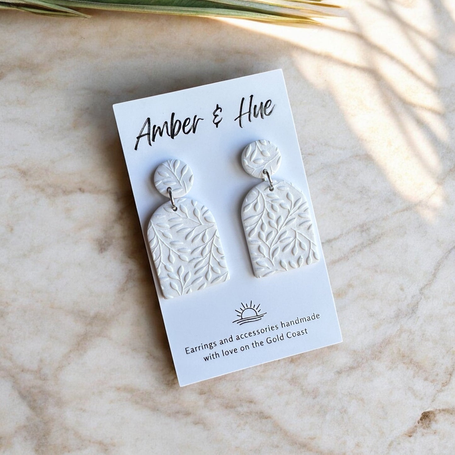 Arch White Dangle Earrings With Leaf Imprint